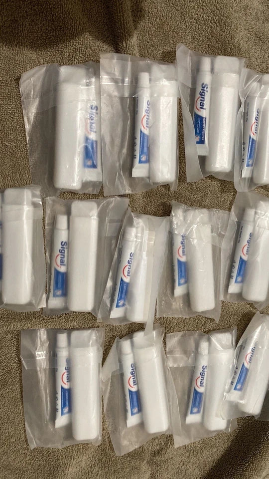 Lot of 13 travel size signal tooth paste and toothbrush