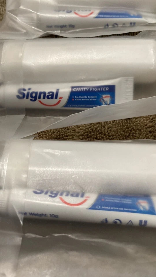 Lot of 13 travel size signal tooth paste and toothbrush